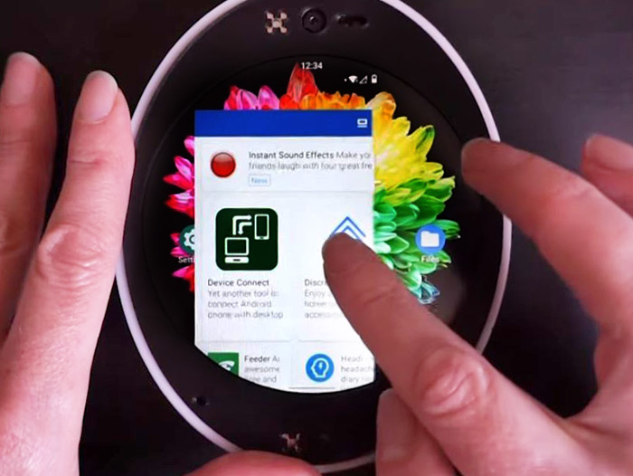 Hands holding a Cyrcle Phone and exploring its display