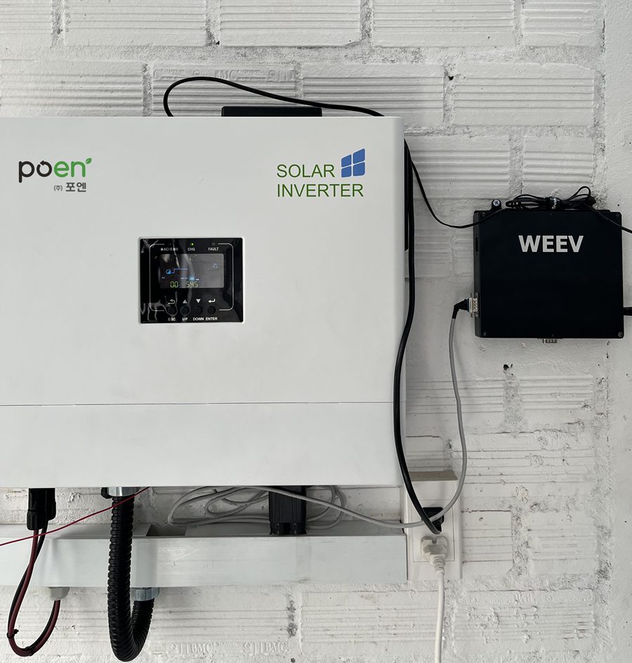 WE'EV solar monitoring device mounted on a wall